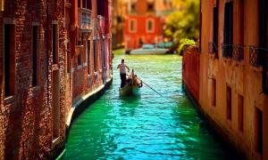 What is hidden at the bottom of the Venetian canals